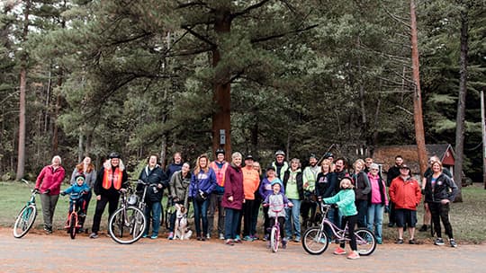 Community members with bikes outdoors